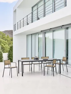 Cane-line Less armchair, stackble, grey - French weave natural