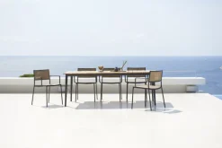 Cane-line Less armchair, stackble, grey - French weave natural