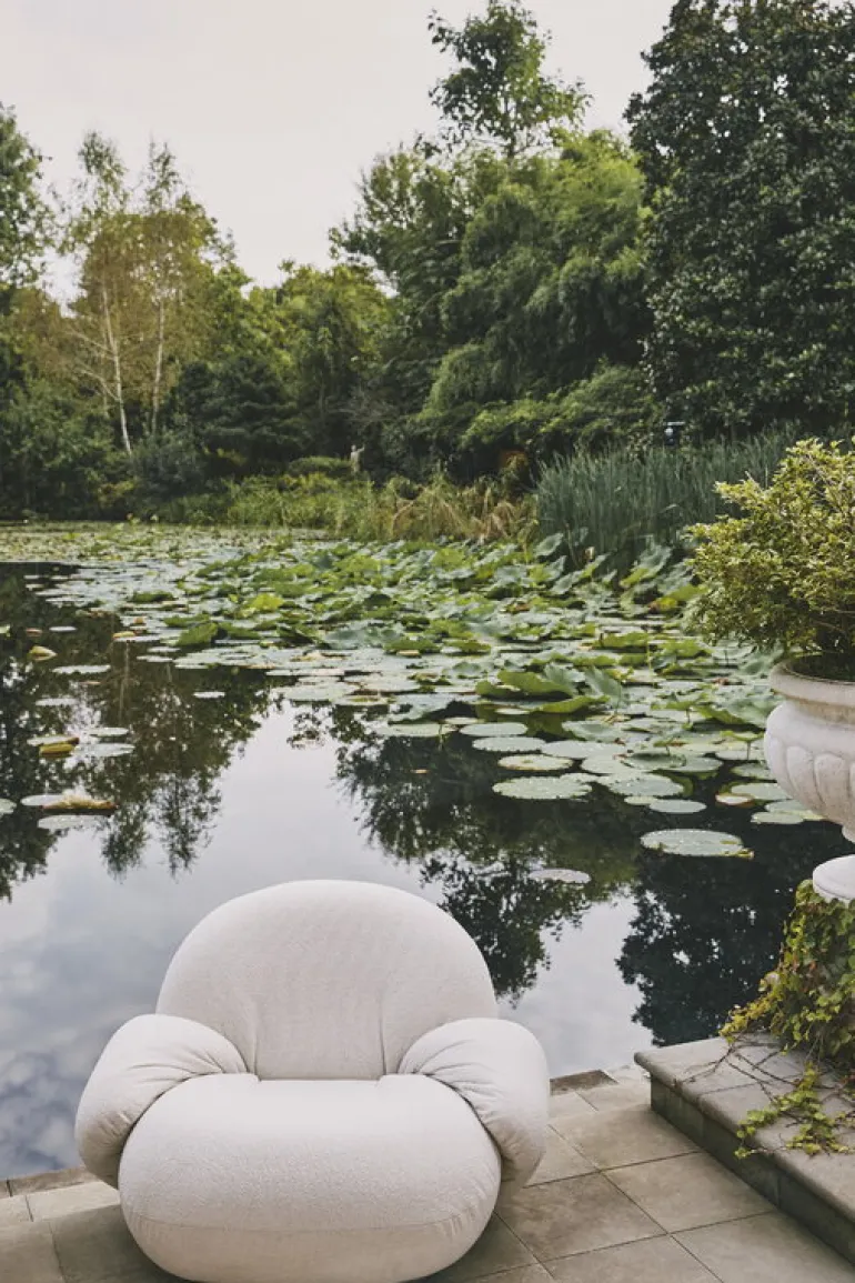 GUBI Pacha Outdoor lounge chair with armrest, swivel base, Lorkey 40